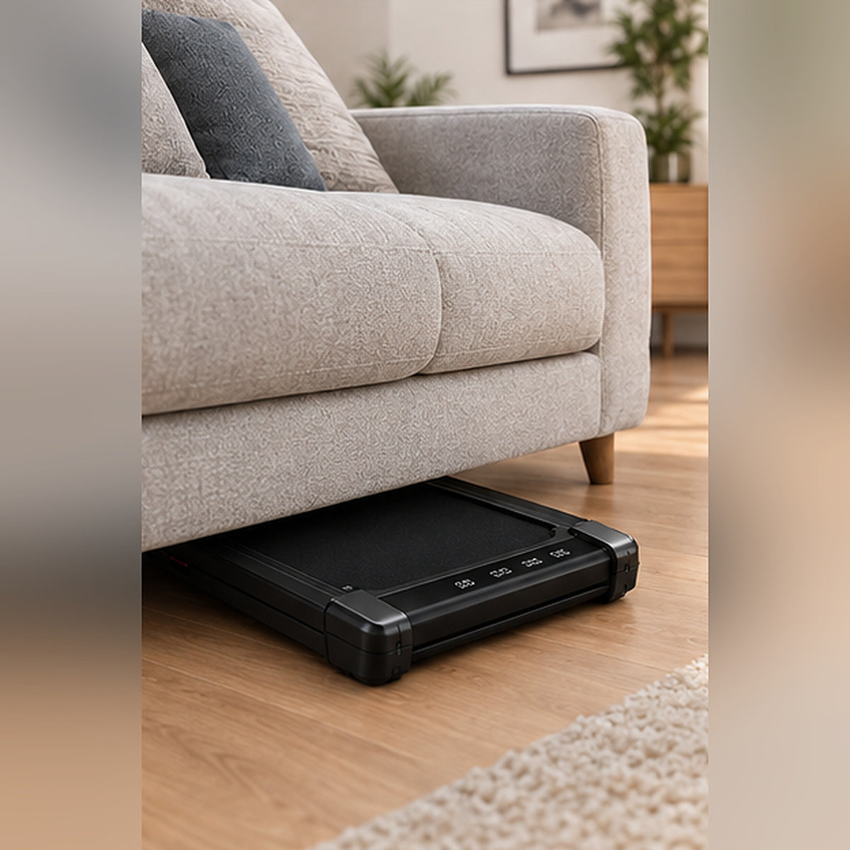 Tapis de marche ALVORE glissé sous un canapé après la séance